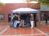 When the rain gets harder, people congregate under the tents